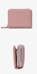 Pink leatherette accordion card wallet for women with zipper and snap closure detail view.