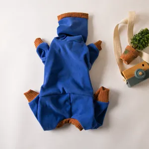 Detailed view of blue pet fleece thermal four-legged dog jumpsuit with brown ribbed collar.