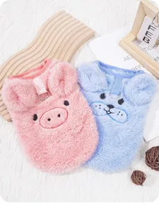 Fluffy pet vest detail, cute cartoon embroidery design, warm fleece lining for winter dogs.