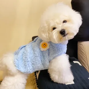 Thickened pet vest for dogs and cats, warm plush winter clothes in light blue with cute smiley flower.