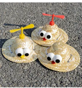 Pet straw hat detail view, cute funny bamboo dragonfly cap with big eyes for cats and dogs.