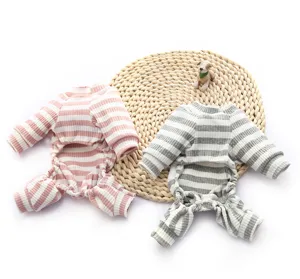 Detailed view of soft striped pet pajamas for small dogs and cats, cozy four-leg knit apparel.