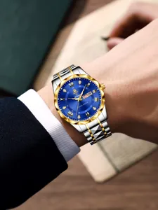 Herren Business Quarzuhr mit blauem Zifferblatt, gold-silbernem Metallarmband und Datumsanzeige.