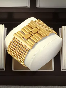 Stunning luxury gold-plated statement bracelet detail featuring exquisite bead rows and bar links.