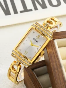 Close up view of the elegant gold rectangular quartz wristwatch featuring sparkling rhinestones.