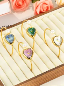 Heart-shaped dial pearl bangle watch, elegant quartz wrist watch with stylish color options.