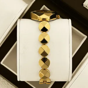 Luxury women gold watch with faceted circular links design, elegant timepiece for daily wear.