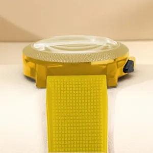 Detail view of men's fashion quartz watch with bold yellow silicone strap and gold case.