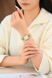 Luxury gold square rhinestone women watch, elegant quartz wristwatch for ladies daily wear.
