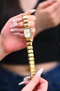 Montre quartz femme mode luxe Yalusi avec bracelet en maille métal dorée et cadran élégant.
