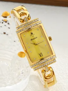 Elegant rectangular quartz watch for women with rhinestones, gold finish and stylish chain strap.