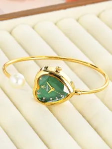 Elegant women's bracelet watch with green heart dial and pearl charm, luxury gold quartz wristwatch.