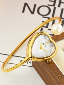 Elegant heart-shaped dial pearl bracelet watch for women, stylish gold quartz wristwatch.
