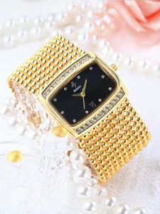 Elegant women watch featuring a rectangular black dial, crystal bezel, and gold beaded strap.