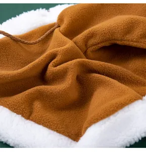 Detailed close-up view of pet winter warm fleece cape fabric texture and soft sherpa trim.