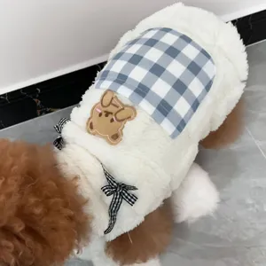 Close-up detail of the plush pet vest back with cute plaid pocket and bear patch decor.