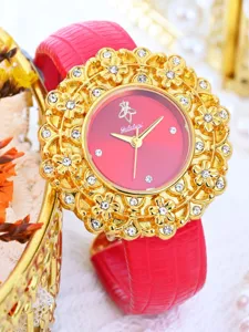 Women's quartz wristwatch featuring red dial, gold floral rhinestone bezel and red leather strap.