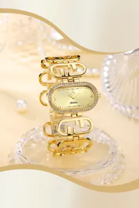 Luxury gold diamond oval women quartz watch with elegant alloy strap and sparkling crystals.