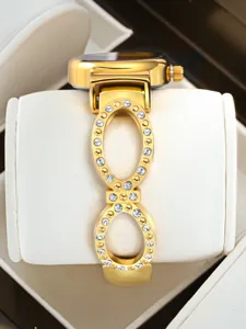 Elegant women's luxury watch with rhinestone embellished double ring bracelet strap design.
