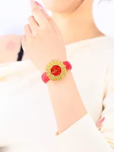 Elegant red leather strap luxury gold rhinestone dial women quartz watch detail shot