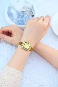 Elegant gold square rhinestone wristwatch for women with Roman numerals and metal strap.