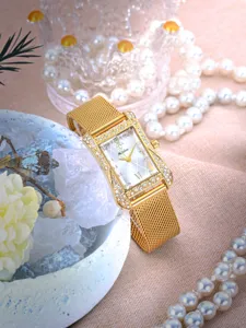 Elegant women's rectangular quartz watch with sparkling rhinestones and mesh gold strap.