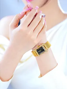 Elegant square quartz ladies watch with gold mesh strap and sparkling rhinestones dial.