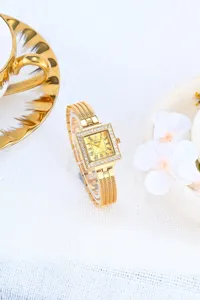 Luxury gold square quartz watch for women with sparkling rhinestones and elegant mesh metal strap.