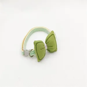Green bow tie pet collar detail shot, adorable plaid cat necklace with buckle and D-ring.