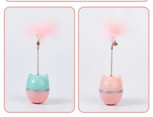 Detalle del juguete interactivo para gatos con pluma, resorte y base basculante rosa.