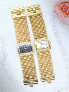 Detailed shot of luxury gold women rhinestone quartz watch with unique mesh strap.
