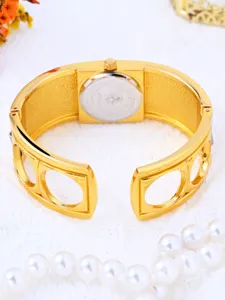 Elegant gold bangle watch for women vintage quartz bracelet watch with open cuff design.
