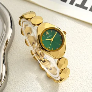 Gold women watch detail view, elegant green dial with bee accent and metallic link bracelet.