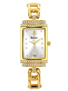 Gold tone rectangular quartz watch detail with rhinestone paved bezel and elegant link bracelet.
