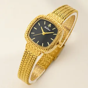 Luxus Damen Gold Mesh Armbanduhr mit elegantem schwarzem Zifferblatt und strukturierter Lünette.