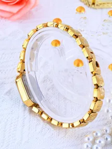 Montre quartz femme dorée style de luxe bracelet à maillons géométriques élégant