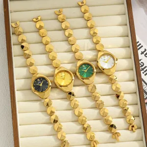 Luxury gold women quartz watch with geometric link strap and multi-color dial detail view.