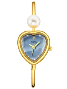 Heart-shaped blue dial quartz watch with elegant pearl accent and crystal markers.