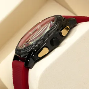Men's sports quartz watch with large black dial gold pushers and red silicone strap.