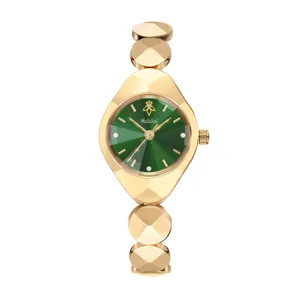 Luxury women's watch with gold geometric faceted case, green dial, and elegant linked bracelet.