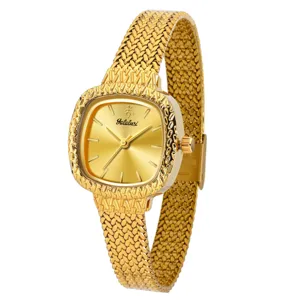 Luxus Damen Goldarmbanduhr mit strukturierter Mesh-Armband und graviertem Zifferblatt.
