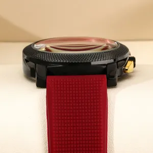 Men's sports quartz watch with bold large dial black case and red textured rubber strap.