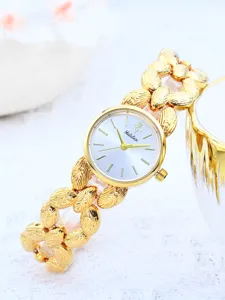 Orologio da donna dorato elegante con cinturino a foglia unico orologio al quarzo di lusso