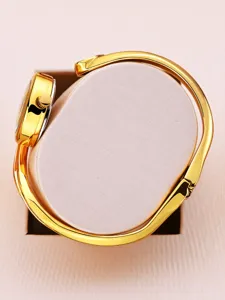 Golden bangle watch detail, elegant women's wristwatch, luxury minimalist design