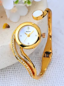Elegant gold cuff bracelet watch for women with sparkling rhinestones and white dial.