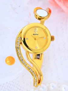 Gold bracelet watch detail view, elegant rhinestone-studded strap and classic round dial design.
