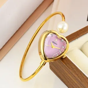 Gold heart-shaped dial pearl bangle watch for women, elegant fashion quartz wrist watch.