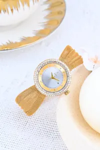 Elegant women's gold quartz watch with dazzling rhinestone bezel and comfortable mesh band