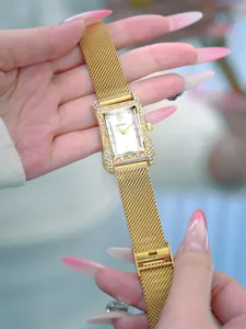 Elegant gold square quartz women watch with sparkling rhinestone bezel and mesh strap.