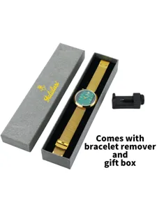 Detailed view of the green dial quartz watch with gold mesh strap, gift box and tool.
